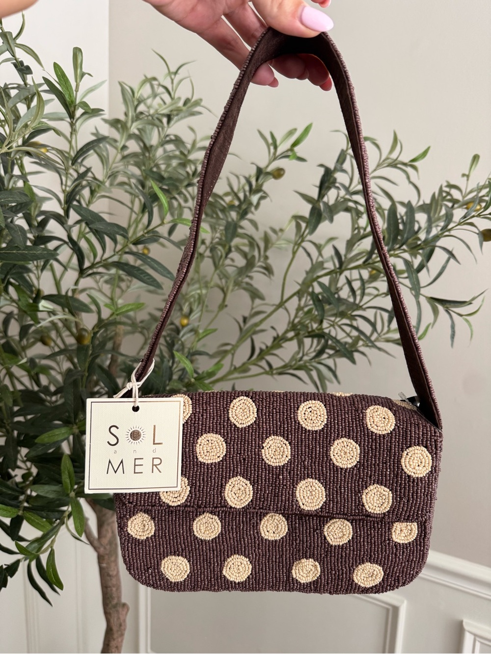 Sol and Mer brown beaded handbag with beige polka dots